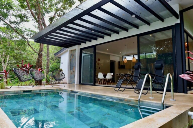 Private pool in front of the glass walled living area at La Junglita, a private pool villa in Playa Junquillal, Costa Rica
